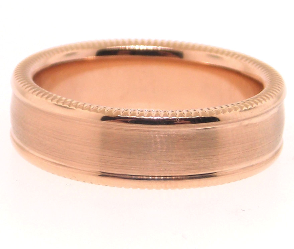 Rose gold ring with a beveled edge on a white background